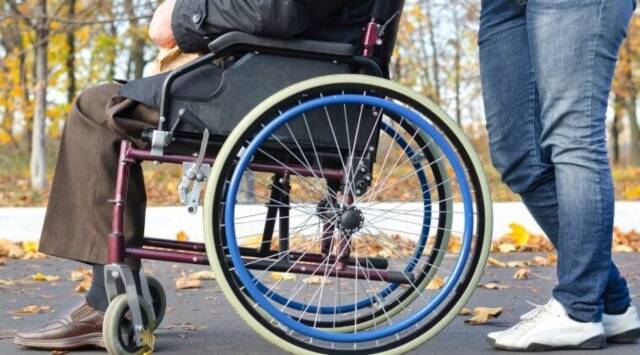 Image of a person sitting on a wheelchair